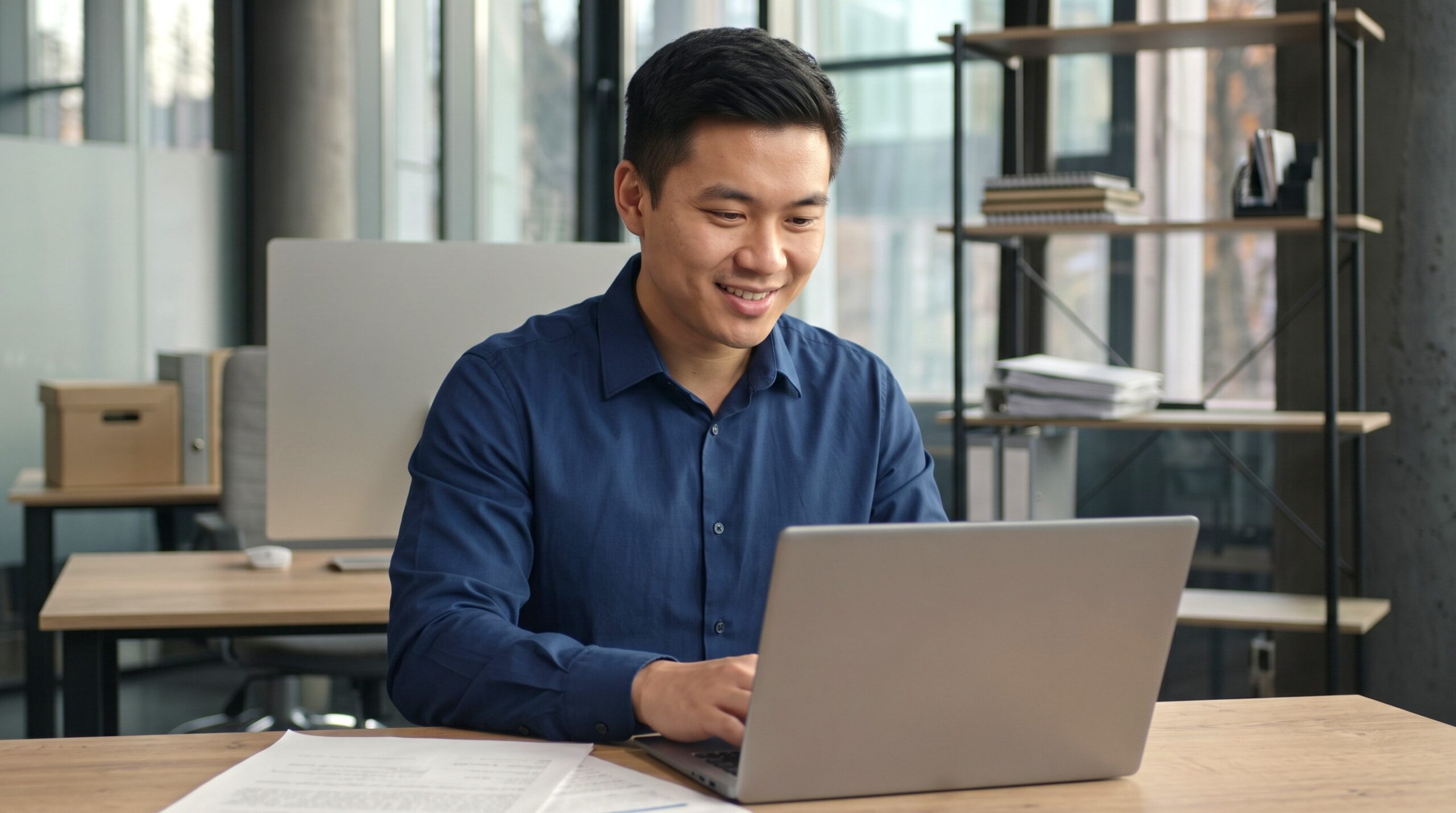 filipino remote project architect analyzing plans in a laptop